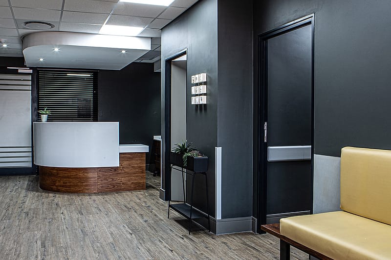 The reception desk and the corridor leading to the consulting rooms.